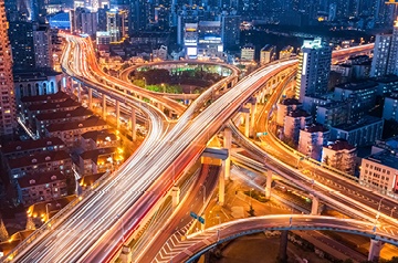 Night view of highway with glowing lights