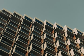 Looking upward along building with geometric design