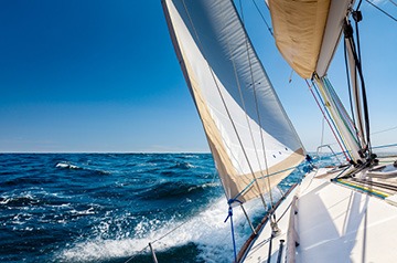 Looking towards front of sailboat on open water