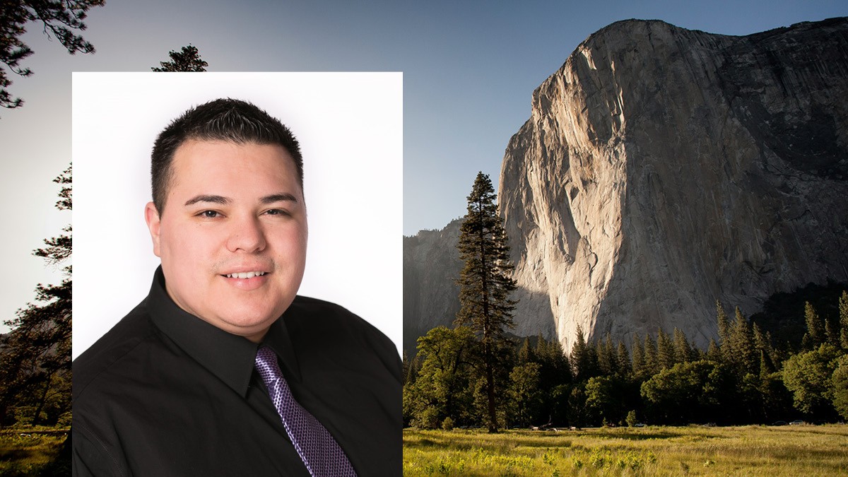 Headshot of Manuel Arroyo over an image of a meadow in front of a rock face