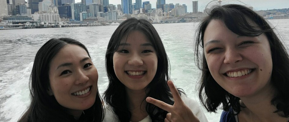 Joleen Lawson and colleagues on a ferry with the Seattle skyline in the background