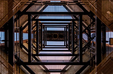 Looking skyward through a geometric stair configuration