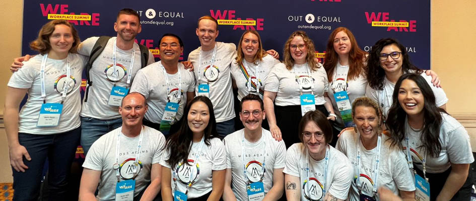 Group posing for a photo at Out & Equal