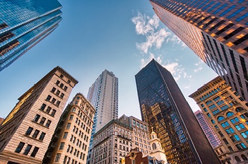 Looking up at tall buildings