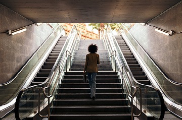 Woman walking up stairs